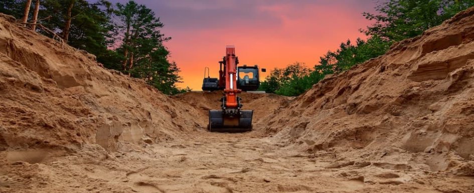 Excavator digging trench/Photo Credit: Adobe Stock
